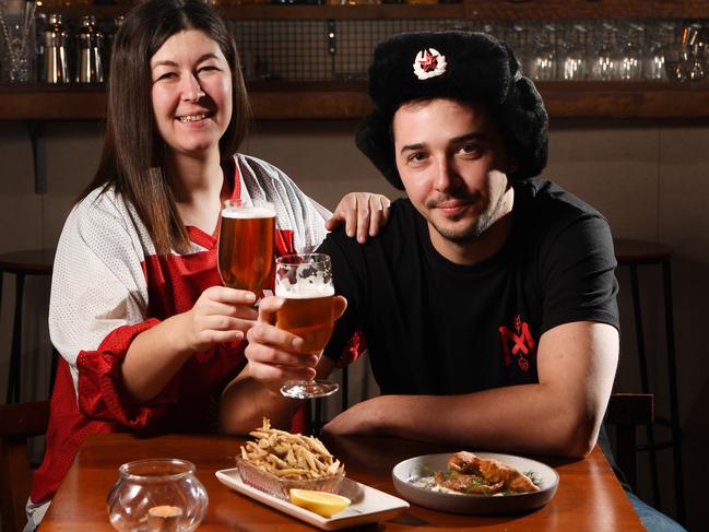 Source cover story on snacks for world cup. Red October co-owners Marina Tazhdynova and Roman Tazhdynov with Fish as Chips and Chebyreki.Pic: Tricia Watkinson