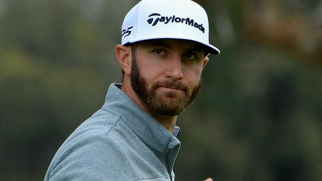 Dustin Johnson reacts to his putt.