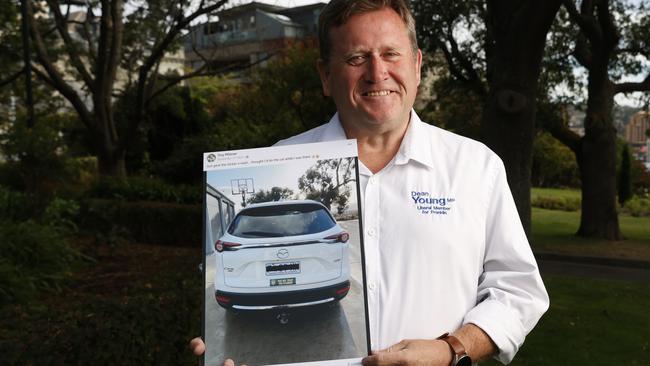 Dean Young showing a social media post by Lambie Network candidate for Lyons Troy Pfitzner. Liberal member for Franklin Dean Young at Battery Point in relation to Lambie Network stance on the proposed new stadium in Hobart for the future AFL team. Picture: Nikki Davis-Jones