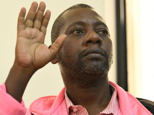 (FILES) Self-proclaimed pastor Paul Nthenge Mackenzie, who set up the Good News International Church in 2003 and is accused of inciting cult followers to starve to death "to meet Jesus", appears in the dock at the court in Malindi on May 2, 2023. A Kenyan court on February 6, 2024 charged self-proclaimed pastor and cult leader Paul Nthenge Mackenzie and dozens of suspected accomplices with murder over the deaths of nearly 200 people. (Photo by SIMON MAINA / AFP)