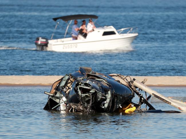 GOLD COAST, AUSTRALIA - NewsWire Photos JANUARY 3RD, 2023:  03 January 2023 - Gold Coast Helicopter Crash: Queensland Police and ATSB Officers recover the wreckage after four people were killed and many more injured after two helicopters collided near Sea World on the GoldCoast, 03 January 2023.Picture Scott Powick