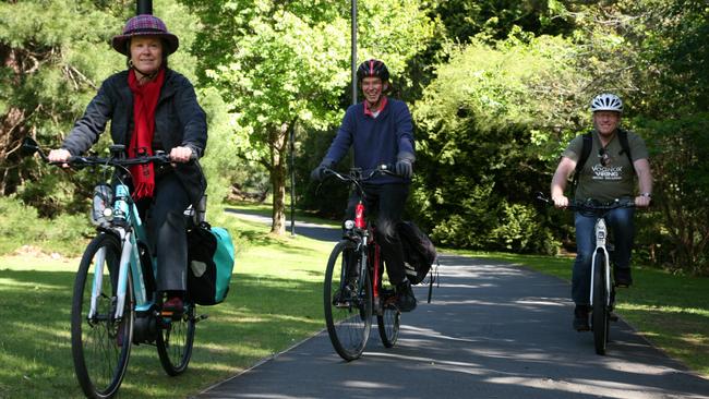 Easy does it: Bicycle Network Tasmania social rides coordinator Di Elliffe, Tasmanian Renewable Energy Alliance executive officer Jack Gilding and independent rider Tony Flowers. Picture: AMANDA DUCKER