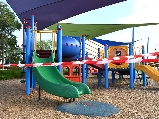 Hazard tape on a play area during restrictions. Picture: Getty Images