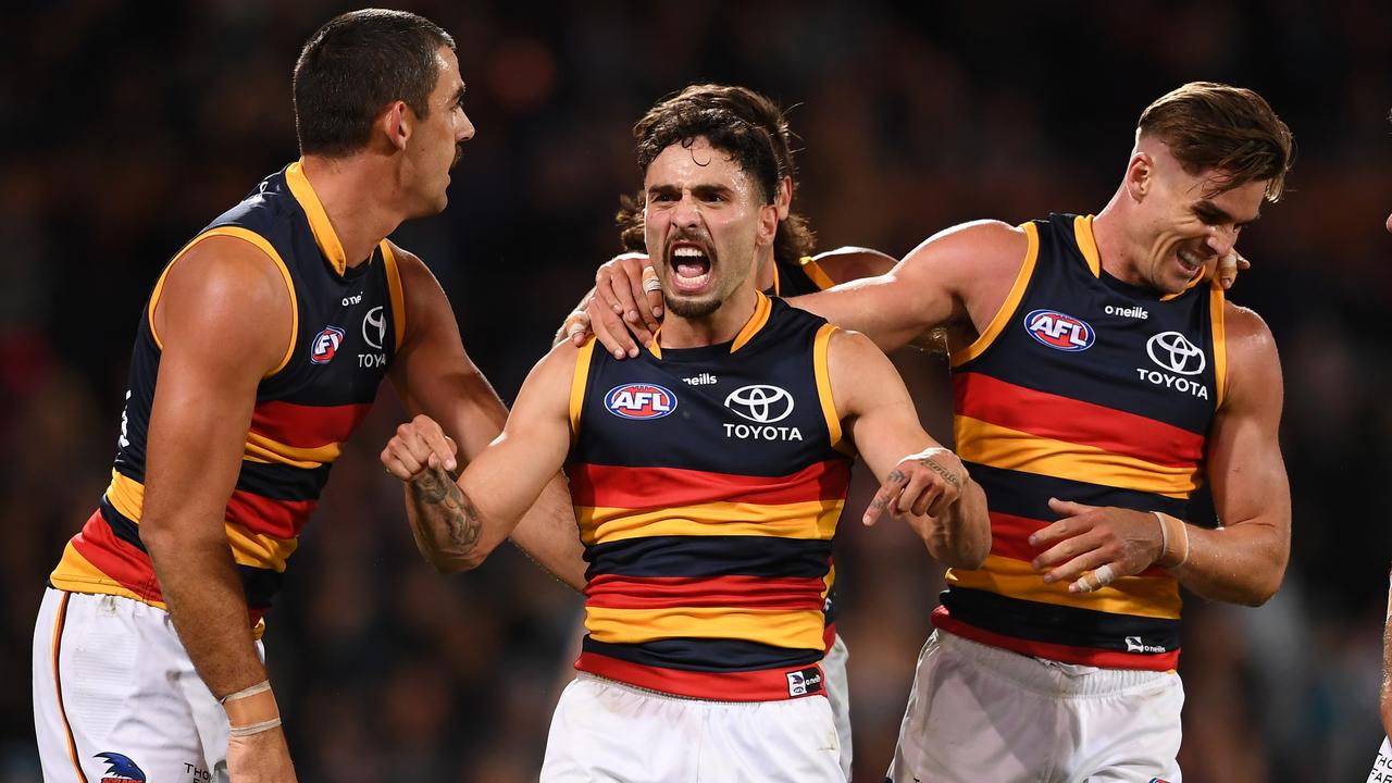 ADELAIDE, AUSTRALIA - APRIL 01: Izak Rankine of the Crows celebrates a goal with Taylor Walker of the Crows and Ben Keays of the Crows during the round three AFL match between Port Adelaide Power and Adelaide Crows at Adelaide Oval, on April 01, 2023, in Adelaide, Australia. (Photo by Mark Brake/Getty Images)