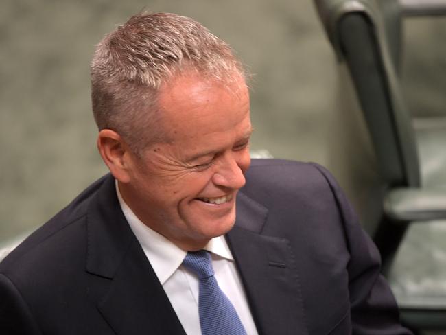 Leader of the Labor Party Bill Shorten smiles while listening to Treasurer Josh Frydenberg deliver the Budget in the House of Representatives. Picture: Getty Images