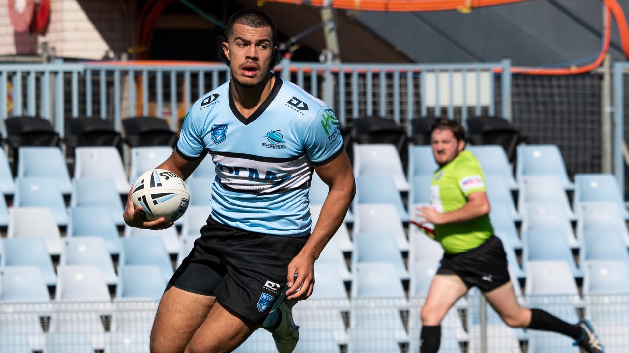 The one that got away ... a Cronulla player on the attack. Picture: Monique Harmer