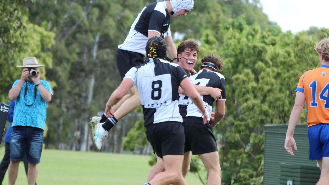 AIC First XV rugby action between Iona and Ashgrove. Iona boys celebrate a first half try.