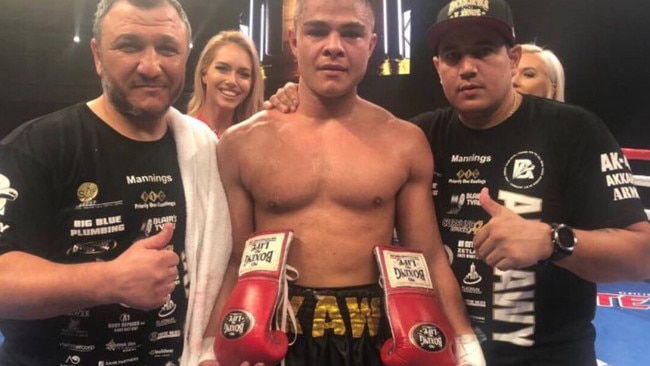 Bilal Akkawy with his trainer and father Mick and trainer Eddy Reynoso after winning his US debut fight.