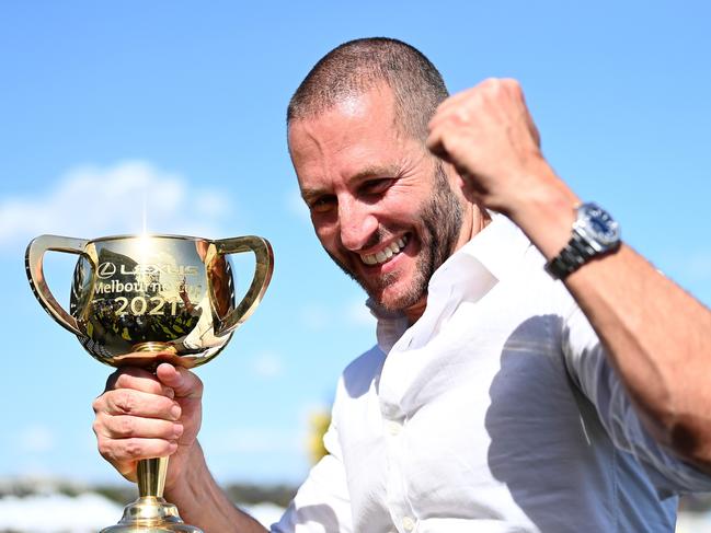 Verry Elleegant owner Brae Sokolski poses with the Melbourne Cup after James Mcdonald rode #4 Verry Elleegant to victory. Picture: Quinn Rooney/Getty Images