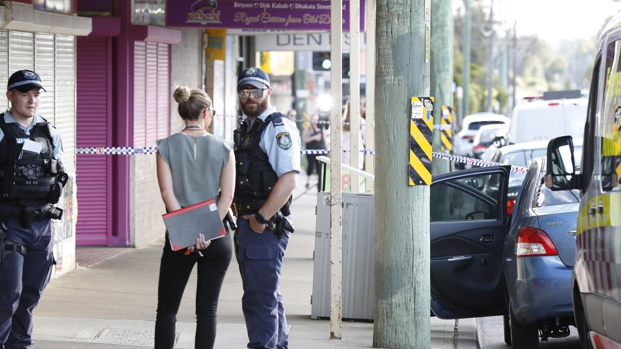 Police on the scene on Railway Parade in Glenfield. Picture: Jonathan Ng