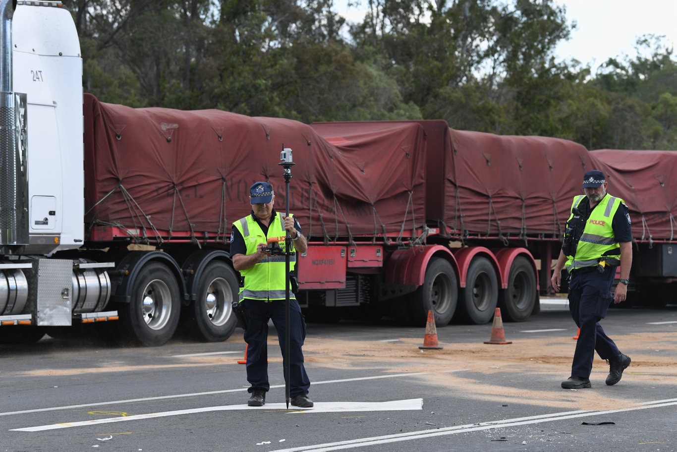 Two vehicle crash at the intersection of Thomas St, Howard and the Bruce Highway. Crash investigators at the scene.