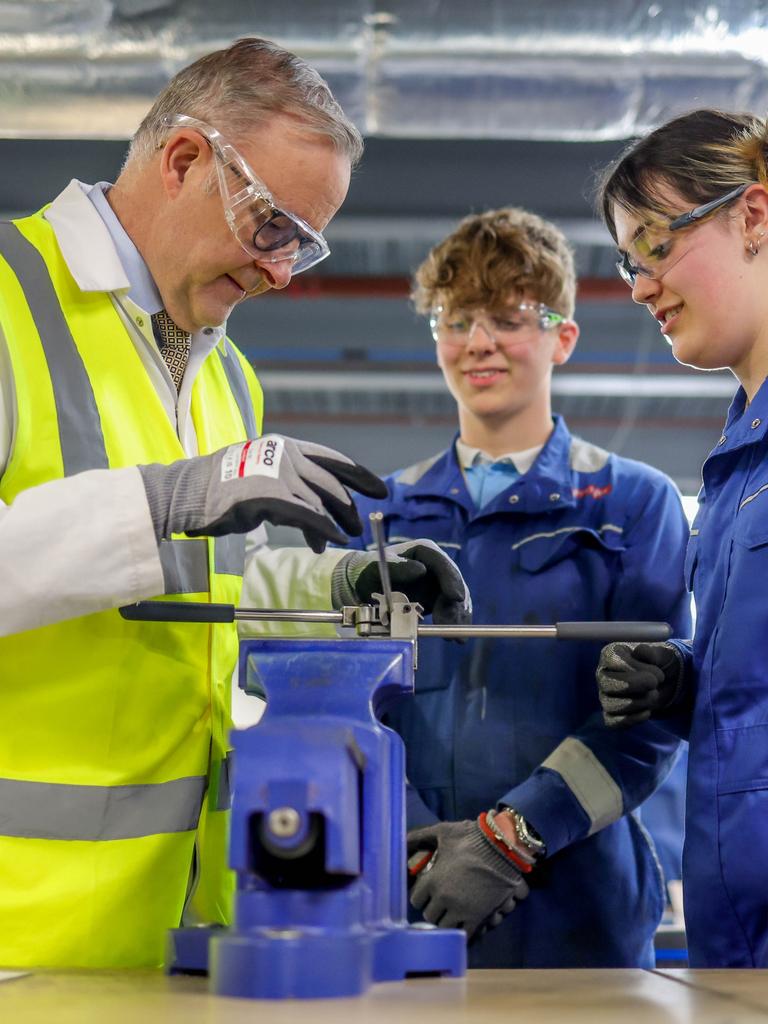 Prime Minister Anthony Albanese with apprentices Jacob Gillibrand and Maddison Baillie at the BAE nuclear submarines shipyard in Barrow-in-Furness, England. Picture: Andrew Parsons