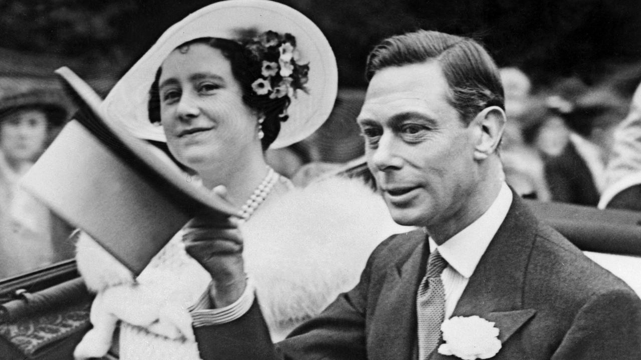 Queen Elizabeth smiles as George VI, King of the United Kingdom, salutes the crowd, on June 26, 1938 in London. Picture: AFP