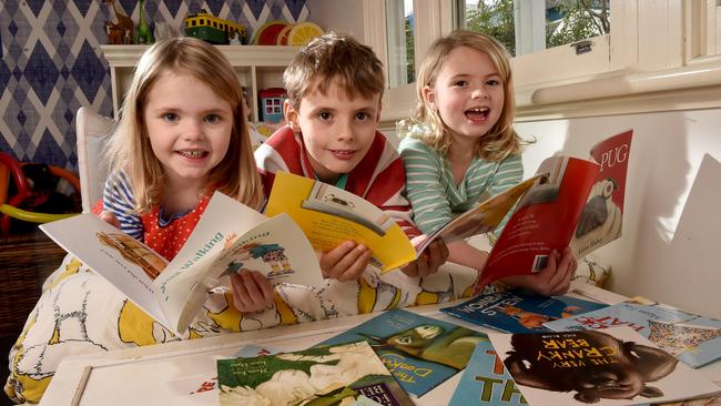 Isabelle, Tom and Alice Dunckley read at home. Picture: Jay Town