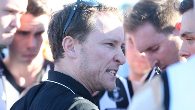 Reynella coach Josh Vick giving instructions to players. Picture: Stephen Laffer