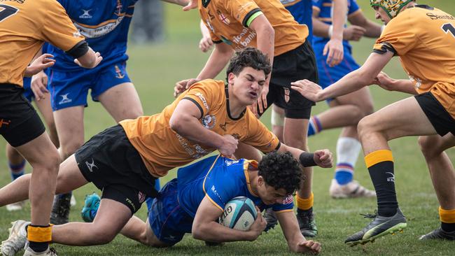 Talen Risati is tackled in a recent rugby battle. Picture: Julian Andrews