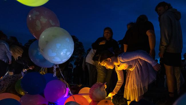 Community members lit candles to remember the children killed in a Corio shed blaze. Picture: Jason Edwards