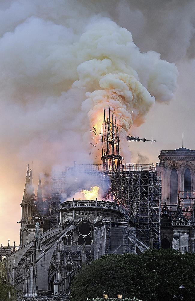 Flames and smoke rise as the spire on Notre Dame cathedral collapses in Paris, Monday, April 15, 2019. (AP Photo/Diana Ayanna)
