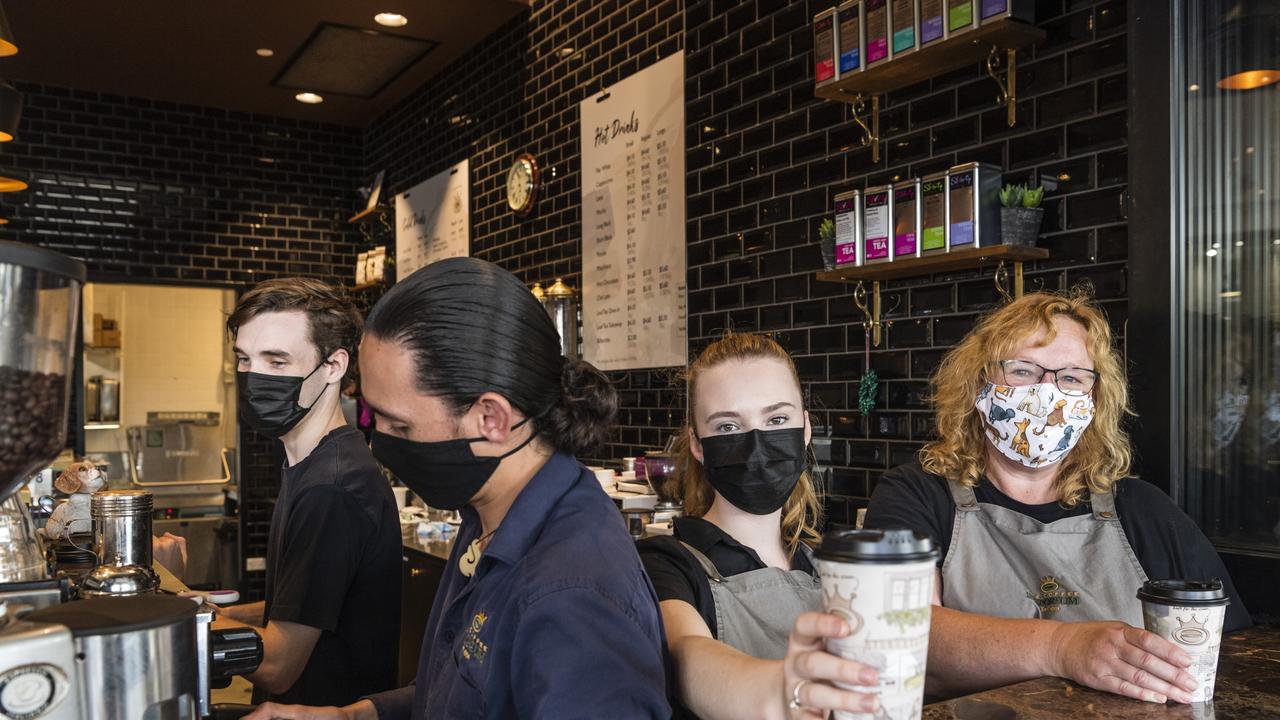 Coffee Emporium staff and owners (from left) Lachlan Hunter, James Riwaka, Georgia Poole and Penny O'Neill serve coffees earlier this while the wearing of masks was compulsory in most indoor settings. Picture: Kevin Farmer