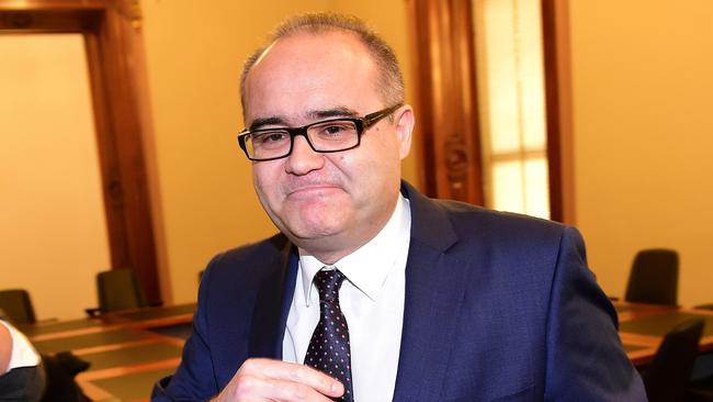 Former Victorian Small Business Minister Adem Somyurek leaves a media conference at Victorian parliament in Melbourne, Tuesday, July 28, 2015. Somyurek has resigned from the ministry following bullying allegations made by his former chief of staff. (AAP Image/Julian Smith) NO ARCHIVING