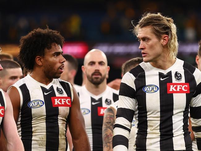 MELBOURNE, AUSTRALIA - JULY 20: The Magpies look dejected following the round 19 AFL match between Hawthorn Hawks and Collingwood Magpies at Melbourne Cricket Ground on July 20, 2024 in Melbourne, Australia. (Photo by Graham Denholm/AFL Photos/via Getty Images)