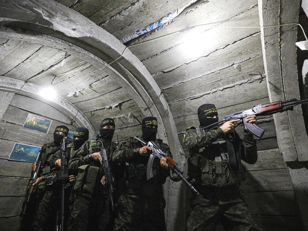 Members of Al-Quds Brigades, an armed wing of the Islamic Jihad Movement, keep guard at tunnels deep beneath Gaza. Picture: Getty