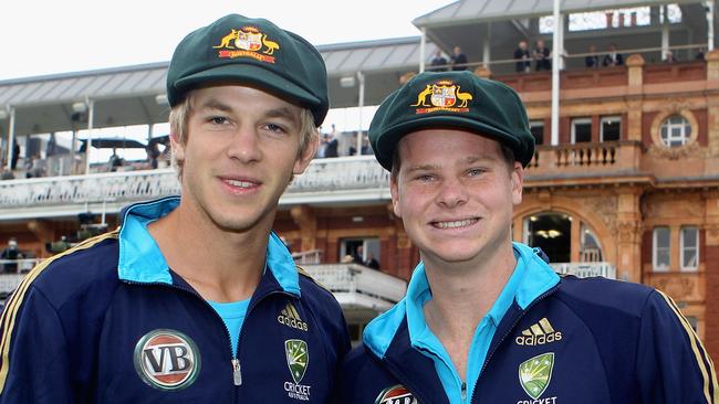 Test debutants Tim Paine and Steven Smith with their new baggy green in 2010. Picture: Getty Images