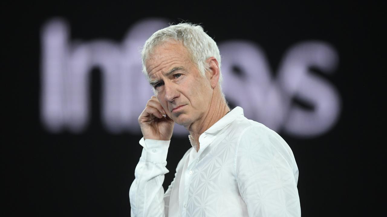 McEnroe smells a fish. Photo: AAP Image/Lukas Coch