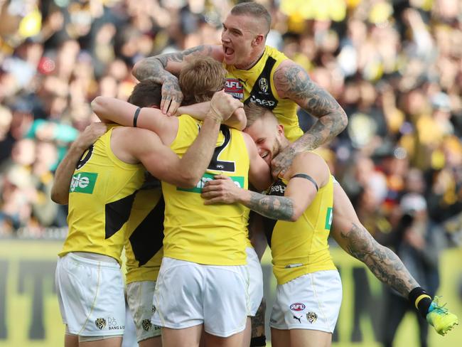 Dustin Martin celebrates with teammates. Picture: Alex Coppel