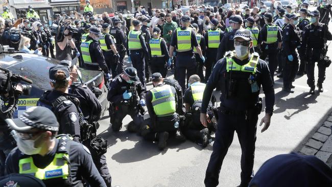 Police arrest anti-lockdown protesters at Victoria Market in Melbourne earlier this month. Picture: David Crosling