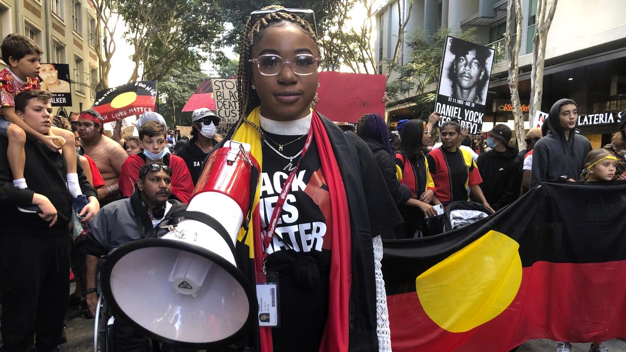 A rally organiser leads a march from King George Square to South Brisbane at a Black Lives Matter protest. Picture: AP Photo/John Pye