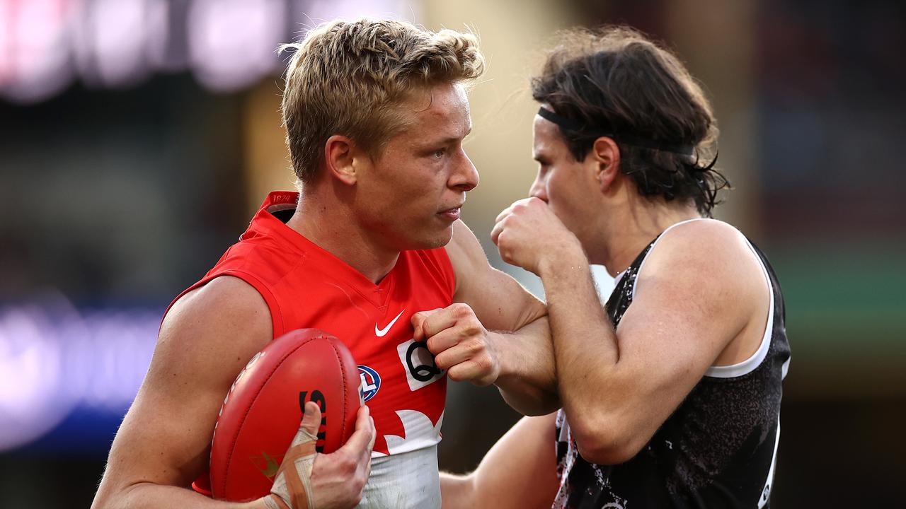 Isaac Heeney and Hunter Clark clash on Saturday. Picture: Cameron Spencer/Getty Images