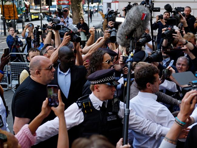 A huge media pack was waiting out the front. Picture: Benjamin Cremel/AFP