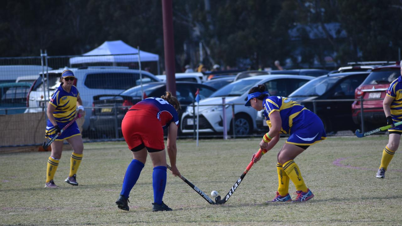 Angela Groves in possession for Warwick against Townsville at the 2021 Queensland Hockey Women's Masters Championship at Queens Park.