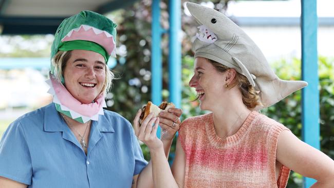 Remie Bampton and Eli Cropp drove to Parramatta Park State School just to eat a “democracy sausage” after voting at a booth with no barbecue. Picture: Brendan Radke