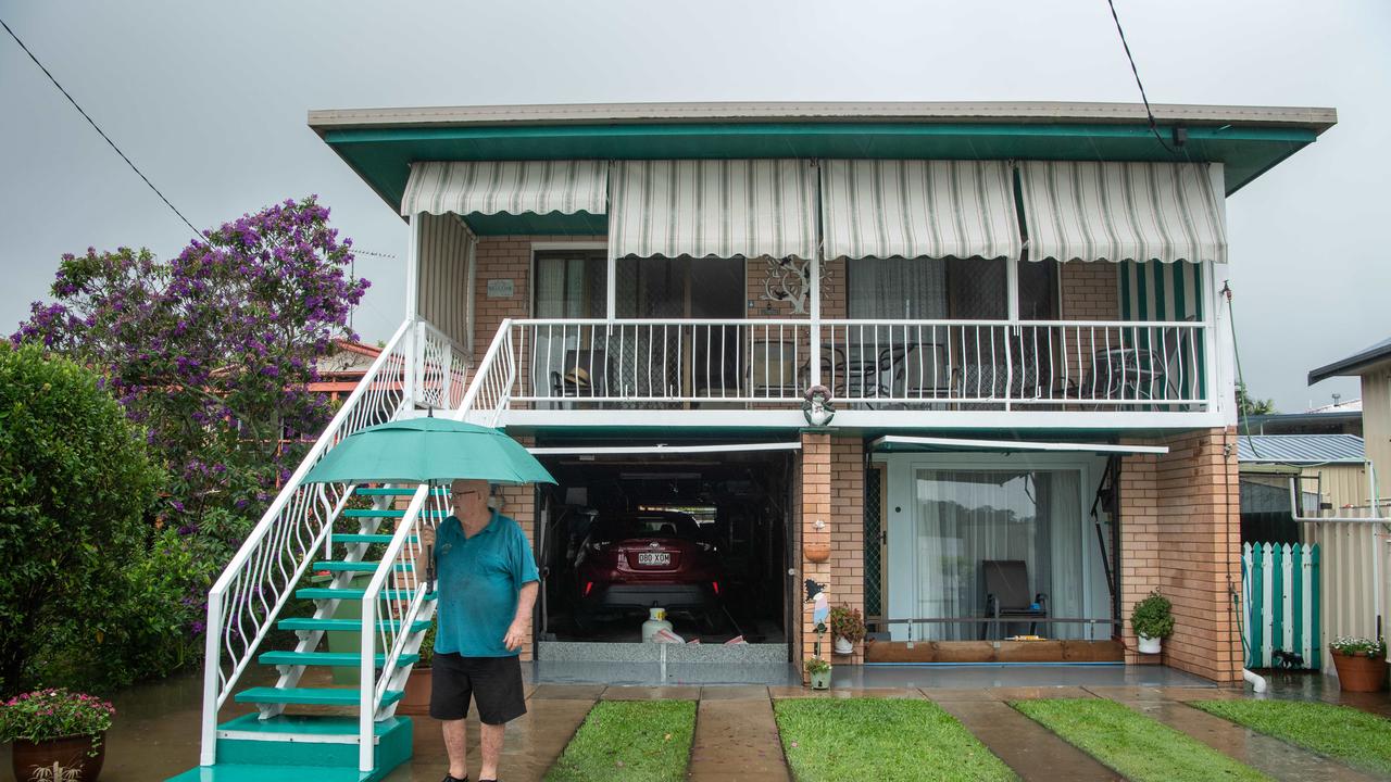 26-02-2022 Flood waters on Sunshine Coast. Bradman avenue resident Allen Davies watches as the Maroochy River rises. Picture: Brad Fleet