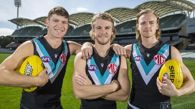 Mitch Georgiades, Jason Horne-Francis and Miles Bergman at Adelaide Oval after training ahead of Thursday night’s final against Geelong. Picture: Mark Brake.