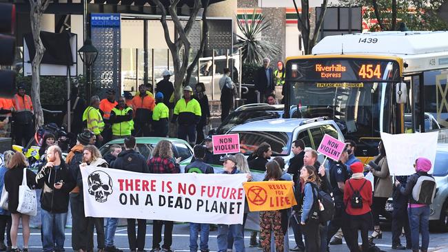 Extinction Rebellion protesters blocking peak hour traffic in Brisbane earlier this month. Picture: AAP Image/Dave Hunt