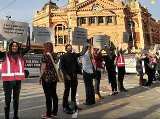 Animal rights protesters block the intersections of Flinders and Swanston Street during early morning traffic in Melbourne, Monday, April 8, 2019. Animal rights protesters are blocking a CBD intersection while south east of Melbourne, others have chained themselves to a truck. (AAP Image/David Crosling) NO ARCHIVING. Picture: DAVID CROSLING