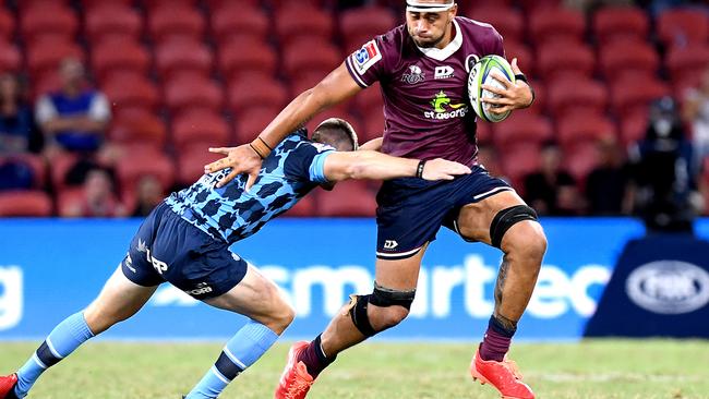 BRISBANE, AUSTRALIA - MARCH 14: Lukhan Salakaia-Loto of the Reds takes on the defence during the round seven Super Rugby match between the Reds and the Bulls on March 14, 2020 in Brisbane, Australia. (Photo by Bradley Kanaris/Getty Images)