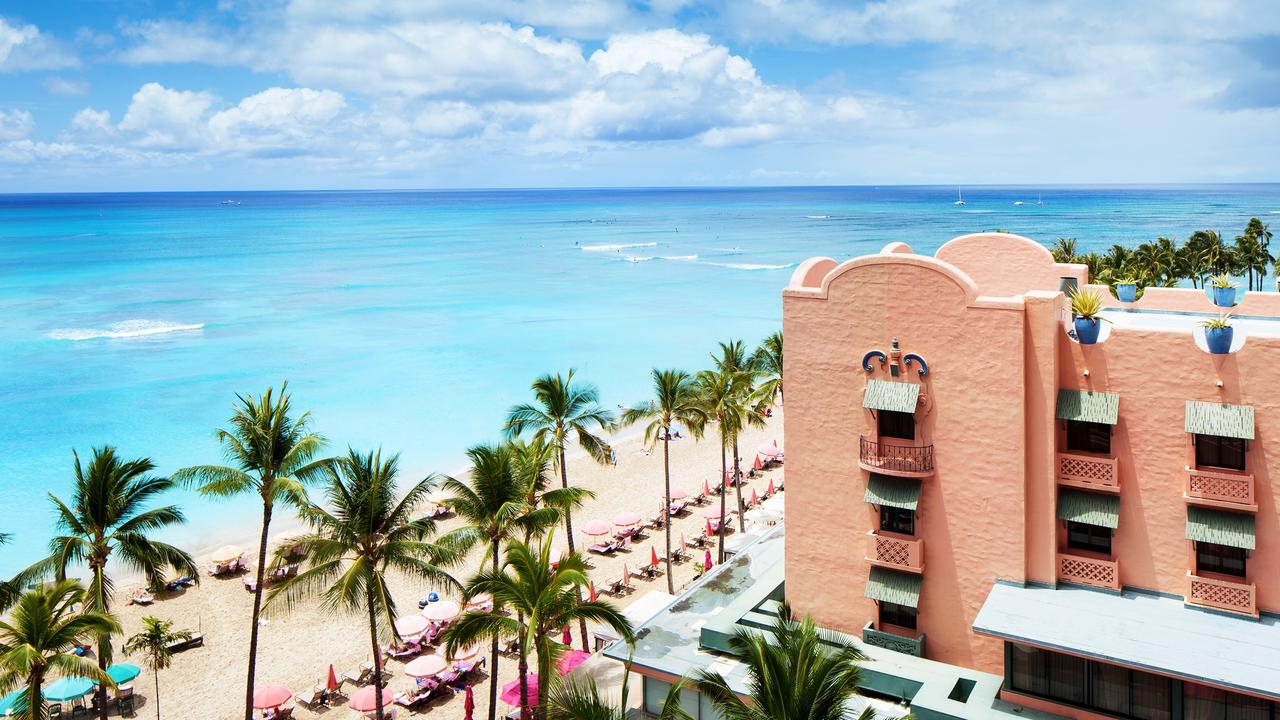 Normally $2943 for seven nights and flights, this deal will have you staying at the Royal Hawaiian Luxury Collection Resort in Waikiki for just $2047. Picture: Mark Silverstein /Starwood