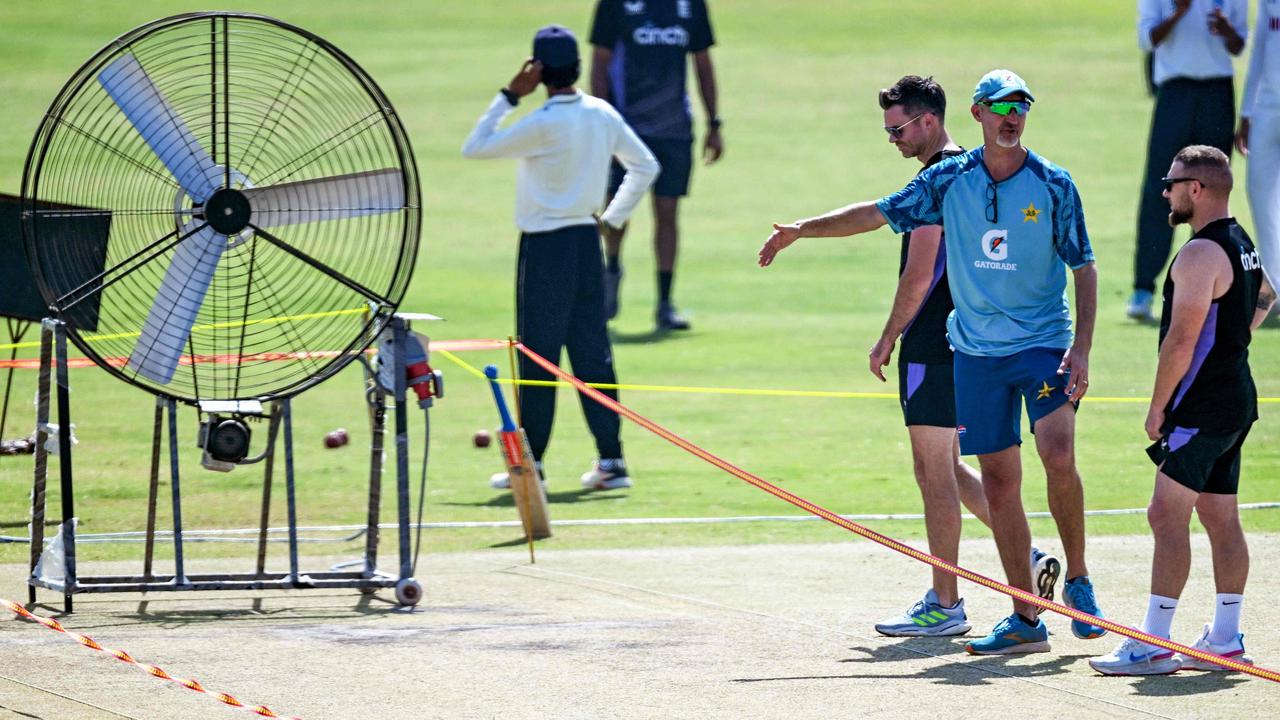 England's head coach Brendon McCullum (R) with his Pakistani counterpart Jason Gillespie (2R) inspects the pitch during a practice session ahead of their second Test cricket match at the Multan Cricket Stadium in Multan on October 13, 2024. Australia pace legend Dennis Lillee denounced a pitch in Pakistan as a "graveyard for bowlers" in 1980, but more than 40 years later little has changed. (Photo by Farooq NAEEM / AFP)