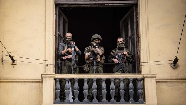 Wagner Group mercenaries stand on the balcony of the circus building in the Russian city of Rostov-on-Don over the weekend. Picture: AFP