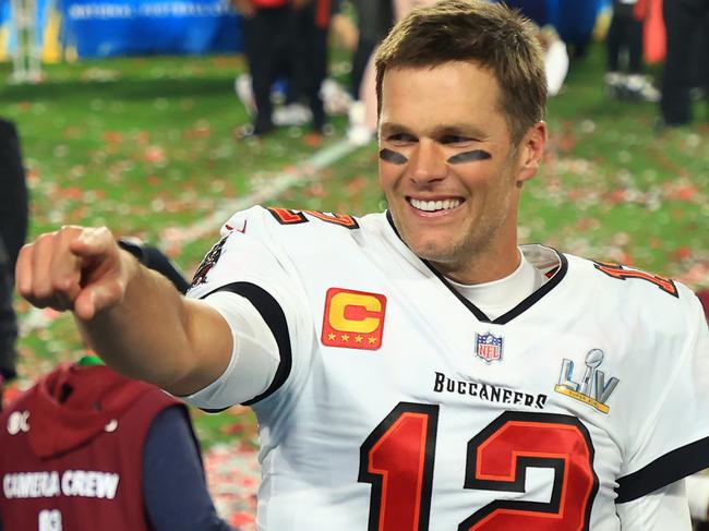 (FILES) In this file photo Tom Brady #12 of the Tampa Bay Buccaneers celebrates after defeating the Kansas City Chiefs in Super Bowl LV at Raymond James Stadium on February 07, 2021 in Tampa, Florida. - If Tom Brady didn't already occupy a seat at the top table of North American sport's greatest icons, he will now be pulling up a chair. The 43-year-old quarterback authored another implausible chapter to his age-defying career on February 7, 2021, winning a record seventh Super Bowl as the Tampa Bay Buccaneers stunned the Kansas City Chiefs 31-9. (Photo by Mike Ehrmann / GETTY IMAGES NORTH AMERICA / AFP)