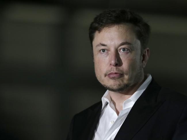 FILE- In this June 24, 2018, file photo Tesla CEO and founder of the Boring Company Elon Musk speaks at a news conference in Chicago. While Tesla grapples with internal issues like production delays, a sometimes-erratic CEO and a recent about-face on whether to go private, its rivals are moving aggressively into the luxury electric vehicle space. (AP Photo/Kiichiro Sato, File)