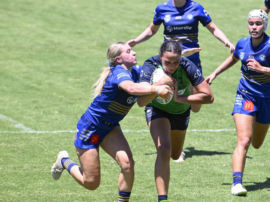 Gabriella Savage goes in for a try. Picture: Martin Ollman