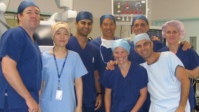 Charlie Teo pictured in the operating theatre with his medical team.