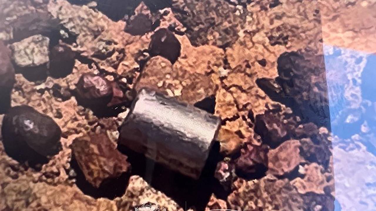 The radioactive capsule after its discovery. (Photo by Handout / various sources / AFP)