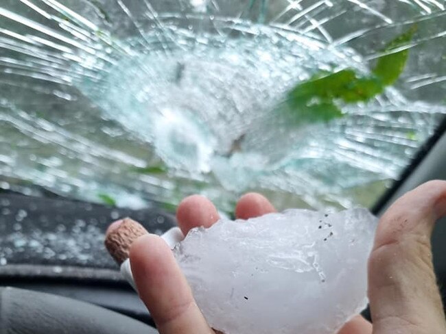 Large hailstones smash car windscreens as storms wreck havoc in Central Queensland.