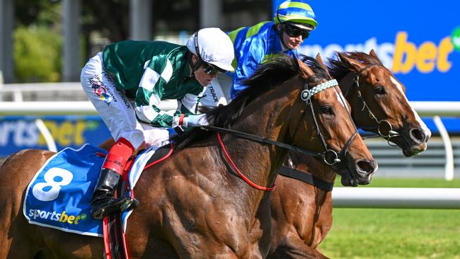 Kimochi (green and white) runs down Another Wil to win the Group 1 Sir Rupert Clarke Stakes at Caulfield. Picture: Vince Caligiuri/Getty Images